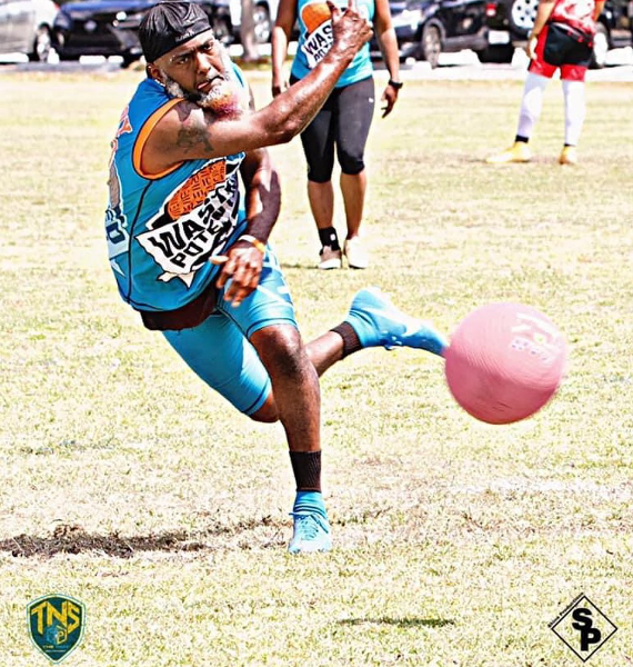 Kickball player pitching in adult sports league