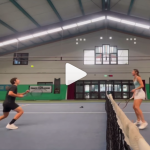 Tennis players warming up with volley ball with their heads